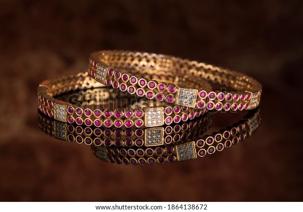 Bangle,\
Indian bracelets isolated on thedark\
background
