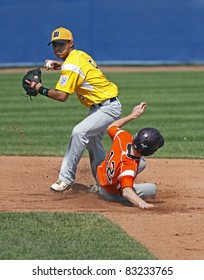 BANGOR, MAINE - AUGUST 19: Chayce Kaaua Of US West (Hilo, Hawaii) Tries For A Double Play At The Senior League Baseball World Series Semifinals Against EMEA (Italy) On August 19, 2011 In Bangor, Maine.