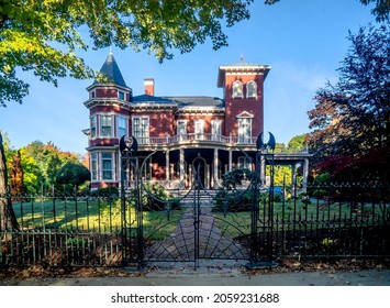 Bangor, ME - USA - Oct. 12, 2021: Horizontal of Stephen King's House. A Victorian mansion, home to the famed horror novelist, with wrought-iron bats  spiders on the gate.