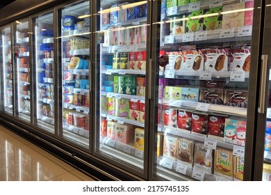 Bangsar, Malaysia - 20 June 2022: Interior view of the huge fridge with various brand ice cream and frozen food in Aeon grocery. Aeon is Japan's single-largest shopping mall developer and operator.