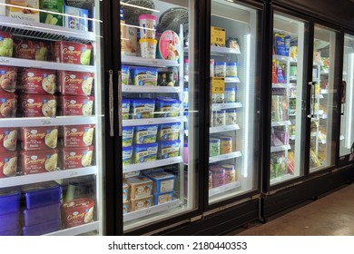 Bangsar, Malaysia - 20 June 2022: Interior view of the huge fridge with various brand ice cream and frozen food in Aeon grocery. Aeon is Japan's single-largest shopping mall developer and operator.