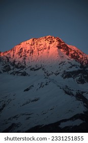 Banguriani Peak at sunset, the last rays of the red sun. Mestia Svaneti Caucasus Mountains Georgia. Mountain landscape 