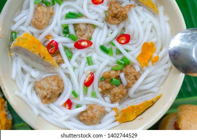 Banh Canh - Rice noodles soup with fried fish ball and Banh Mi Cha Ca - Vietnamese bread with fried fish and chili fish sauce inside. This is a typical combo for breakfast in south central of Vietnam