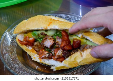 Banh Mi Pha Lau - Vietnamese bread with topping from beef (meat) and offal
