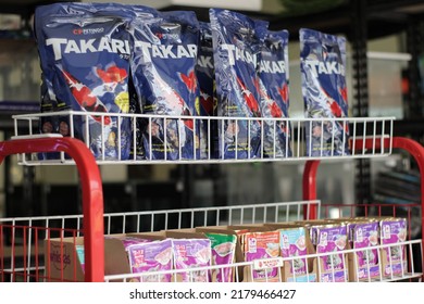 Banjar, West Java - July, 16, 2022: Fish Feed And Cat Food Sold On A Pet Store Shelf