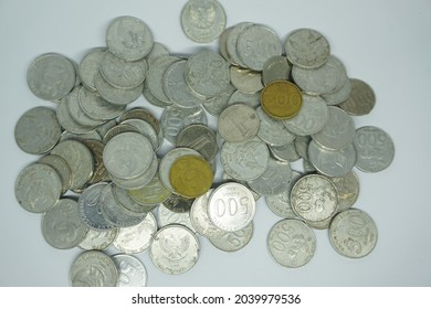 Banjarnegara, Indonesia - September, 2021: A Collection Of Rupiah Coins On A White Warrant Paper Background