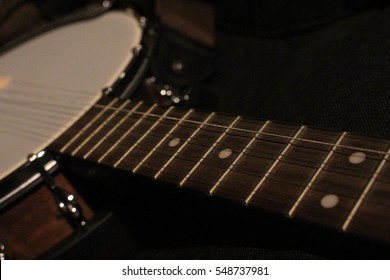 Banjo neck and drum close up