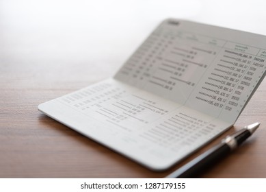 Bank Account Passbook On Desk.