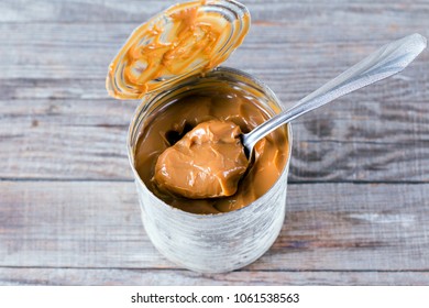 Bank Boiled Condensed Milk On A Wooden Table