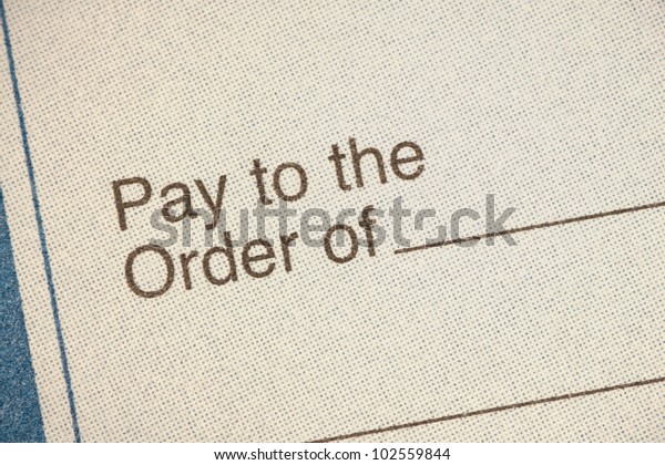 Bank check closeup\
pay to order of cheque