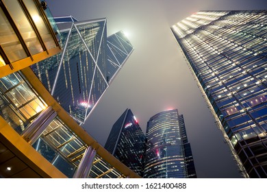 Bank Of China Tower Building. That Skyscraper In Hong Kong City With Modern Architecture Exterior Design. Night Sky Reflection With Glass Of Window. Center Of Corporate, Business, Financial Service.