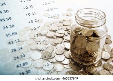 bank with coins and counting close up