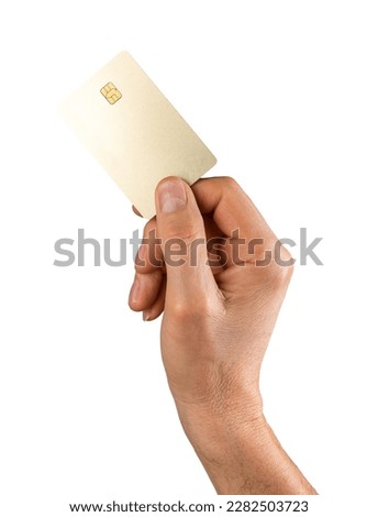 Bank credit card mock up in male hand isolated on white background. Blank clean gold debit plastic bankcard.