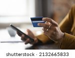 Bank customer woman using credit card, mobile phone, shopping online with ecommerce application, virtual payment service, Internet bank, buying on store websites, paying for purchase. Close up of hand