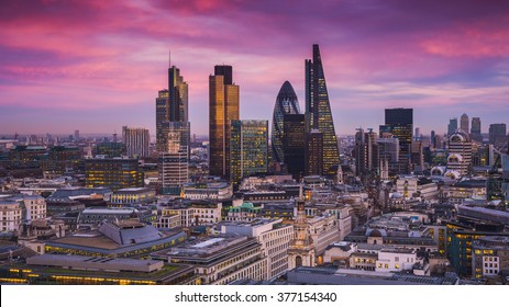 Bank district of central London at magic hour after sunset with office buildings and beautiful purple sky - England, UK