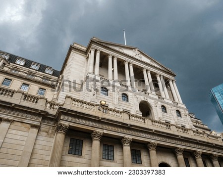 The Bank of England under dark stormy clouds, London, UK