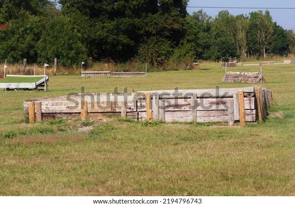 Bank jump at an equestrian cross country\
schooling venue, where horses train.\
