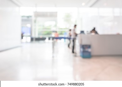 Bank office blur background business customer or patient counter service, cashier desk in lobby inside blurry hospital, office building or hotel waiting area in reception hall