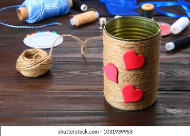 Bank For Pencils With Hearts Wrapped With String On A Wooden Table. Handmade.  Pencil Holder.