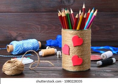 Bank For Pencils With Hearts Wrapped With String On A Wooden Table. Handmade. Pencil Holder.