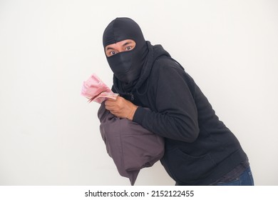 Bank Robber Wearing Black Balaclava And Hoodie For Disguise, Managed To Rob A Bank And Run Away With A Bag Full Of Money