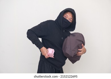 Bank Robber Wearing Black Balaclava And Hoodie For Disguise, Managed To Rob A Bank And Run Away With A Bag Full Of Money