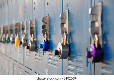 Bank Of School Lockers With Colorful Locks.