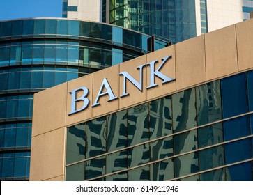 Bank sign on glass wall of business center - Shutterstock ID 614911946