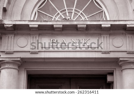 Bank Sign over Entrance Door in Black and White Sepia Tone