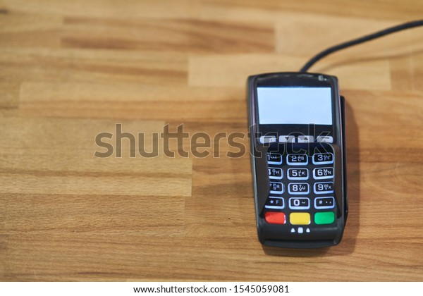 Bank terminal for payment in a cafe.\
Contactless payment\
terminal.