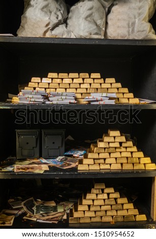 Bank vault with gold and cash
