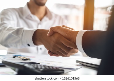 Banker And Client Shaking Hands After Business Loan Grant.