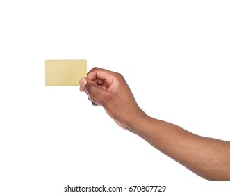 Banking services. Black male hand holding blank plastic credit card on white isolated studio background, copy space, cutout