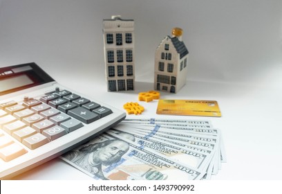 Banknote Dollar, Calculator And Credit Card Are Important In Calculate Saving For Homeowner, Repair, Expand, Leasing Or Transactions Such As Refinance, Mortgage, Decrease Interest Or Debt Restructure.