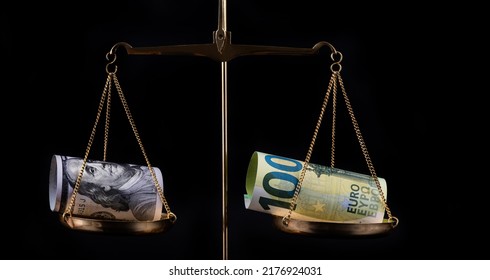 Banknotes of 100 US dollars and 100 euros on scales - Powered by Shutterstock