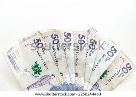 Banknotes of 50 thousand Colombian pesos in fan shape on a white background