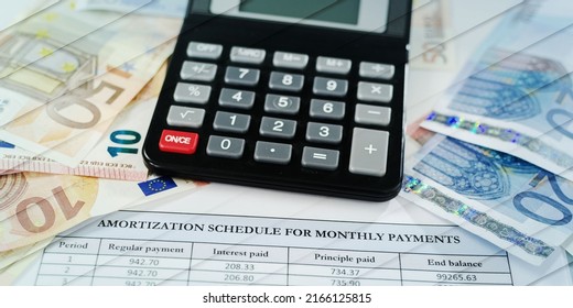 Banknotes, calculator and amortization schedule, geometric pattern