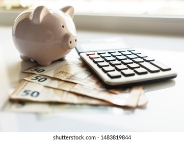 Banknotes and Calculator, Euro Banknotes on White Background, Money, Finance, Tax, Profit and Costing, 50 Euro, Euro Bills, Compound Interest Rate Calculation or Financial Investment Business Concepts