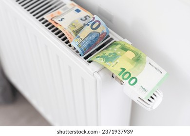 Banknotes for a heating radiator in the house. Central heating in the apartment. Economical consumption of resources.
