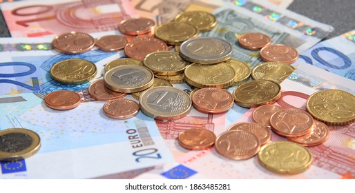 Banknotes and small change on a table