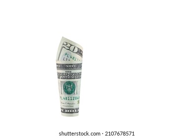 Banknotes Of The United States Dollar.
Roll Of Twenty US Dollars Isolated On A White Background.