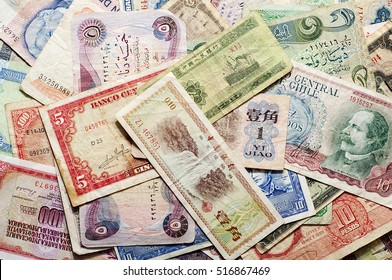 banknotes of various currencies on the table