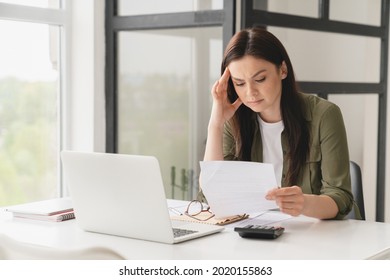 Bankrupt. Young tired stressed overworked businesswoman freelancer teacher student exhausted after hard work, suffering from migraine headache at office. Deadline, fired worker, debt, problems concept
