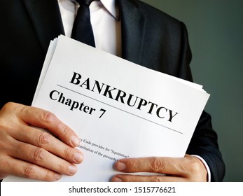 Bankruptcy Chapter 7 documents in the hands.