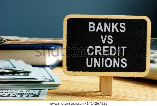 Banks vs\
Credit Unions concept. Money and\
ledger.