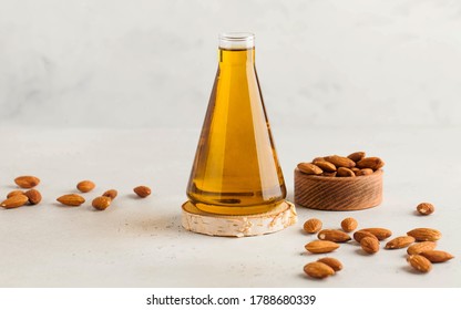 Banner Almond Vegetable Oil In A Flask With Almond Nuts Around. The Concept Of Healthy Eating. Copy Space.