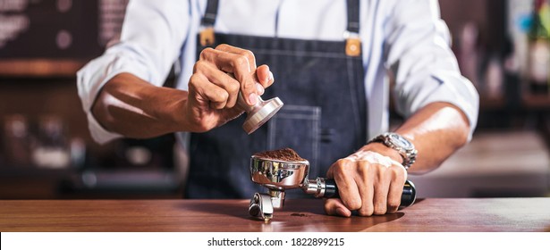 Banner Of Asian Barista Tamping The Portafilter And Preparing Cup Of Coffee, Espresso With Latte Or Cappuccino For Customer Order In Coffee Shop,Small Business Owner And Startup In Coffee Shop Concept