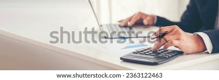 Banner Asian Business man hands using calculator counting tax financial bill. Tax audit Finacial concept. Panorama Close up businessman hands calculating number tax audit planning with copy space