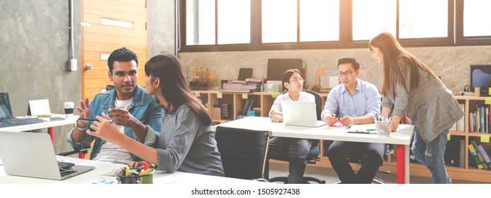 Banner Of Asian Happy Business Creative Team In Routine Work Creative Lifestyle Sitting And Talking Together At Modern Office. Diverse Teamwork Or Employee Brastorming Concept.