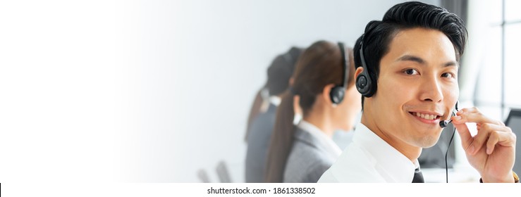 Banner Asian Man Call Center, Customer Service, Telesales In Casual Touch Headset Or Headphone And Look At Camera